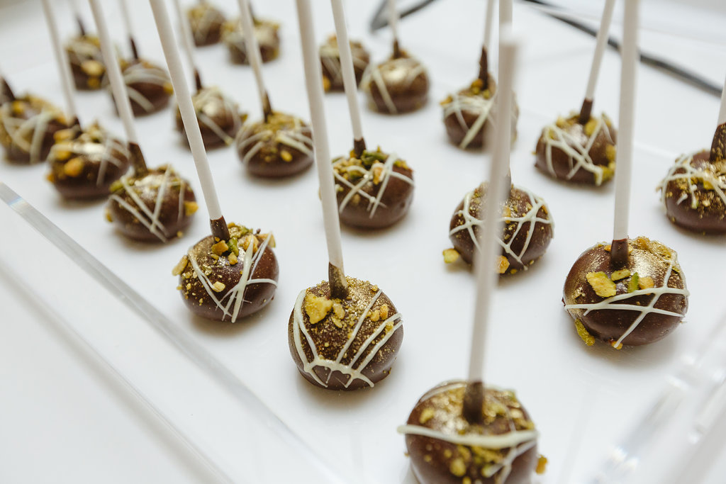 chocolate cheesecake pops with gold flecks 
