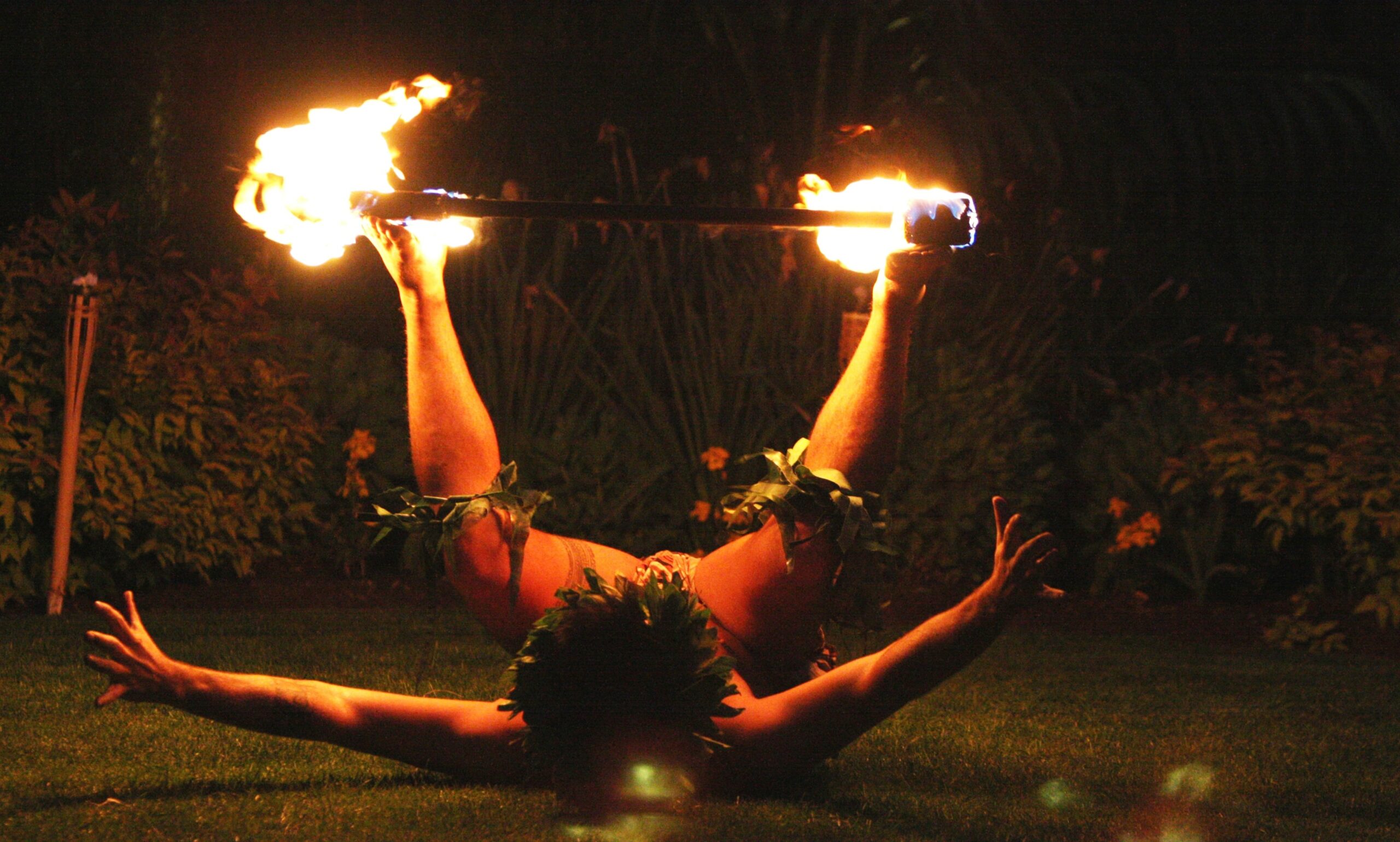 Fire dancer at tropical themed office summer party